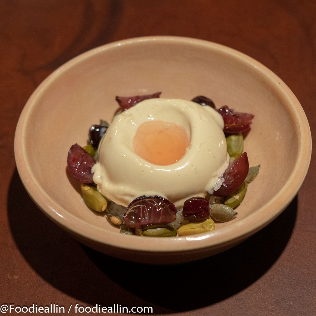 Foie Gras ice cream with preserved unripe strawberries, gooseberries, pistachios and pumpkin seeds